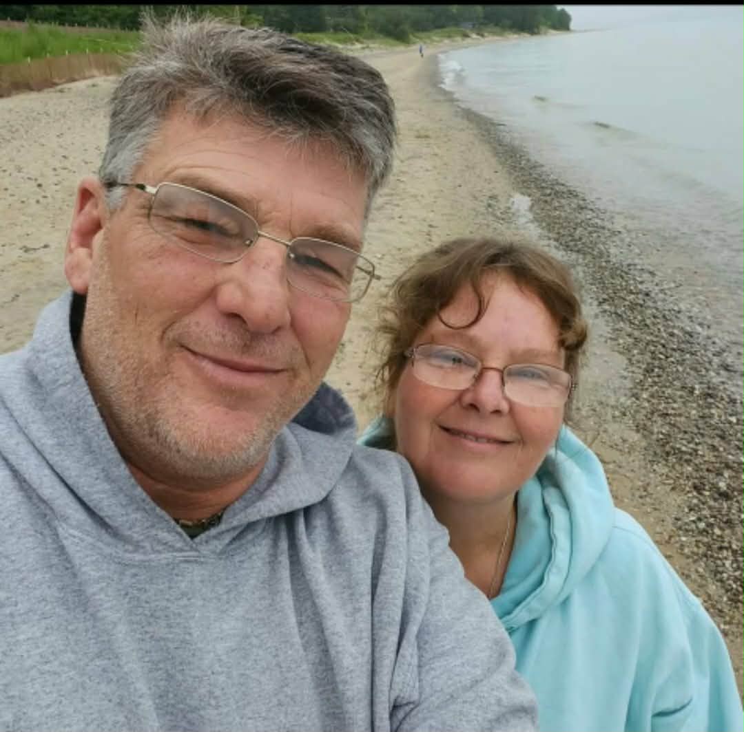 Jennifer and Scot Wack on a Lake Michigan beach