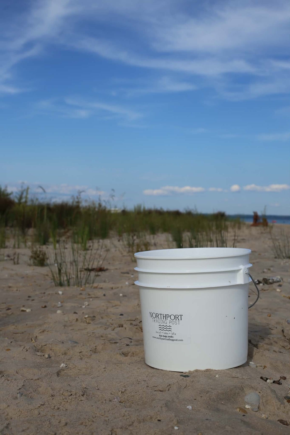 A Trading Post bucket on a sandy Lake Michigan beach